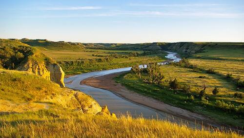 The Little Missouri River flowing through Theodore Roosevelt National Park .