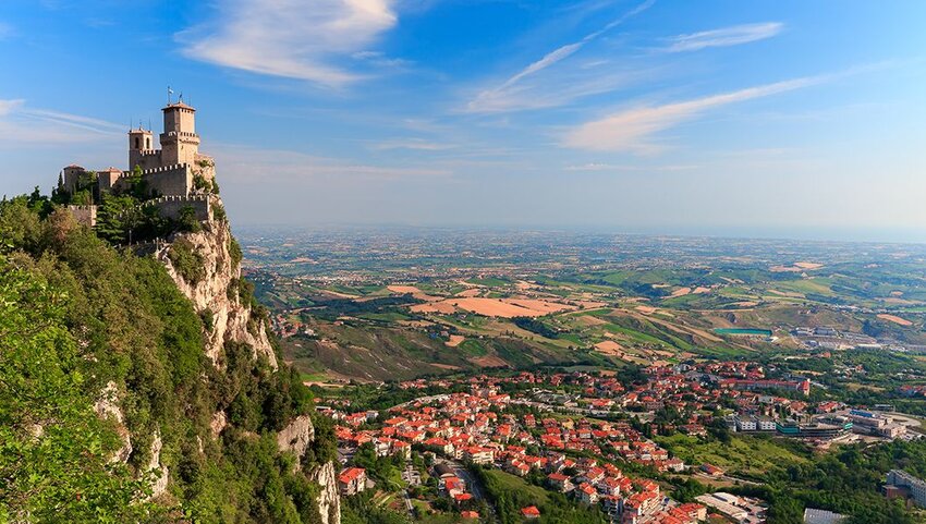 Aerial of fortress on a rock and San Marino.