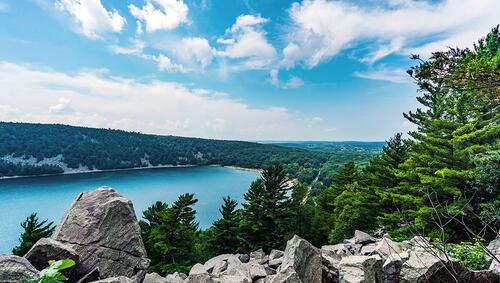 Rocky overlook view of lake and hills in Devil's Lake State Park near Baraboo, Wisconsin.