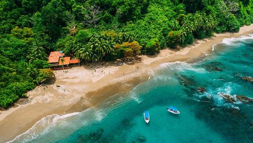 Aerial of a tropical island with lush jungle in Costa Rica, Isla del Caño