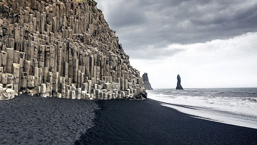 The black sand beach of Reynisfjara and the mount Reynisfjall.