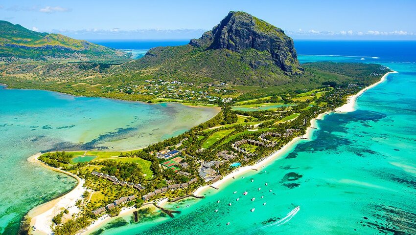 Aerial of Mauritius island and Le Morne Brabant mountain, blue lagoon and underwater waterfall