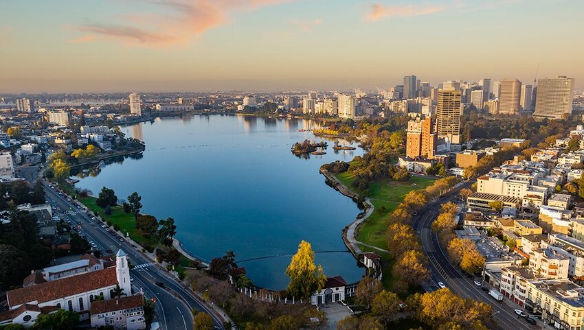 Aerial of downtown Oakland California and Lake Merritt early in the morning at sunrise.