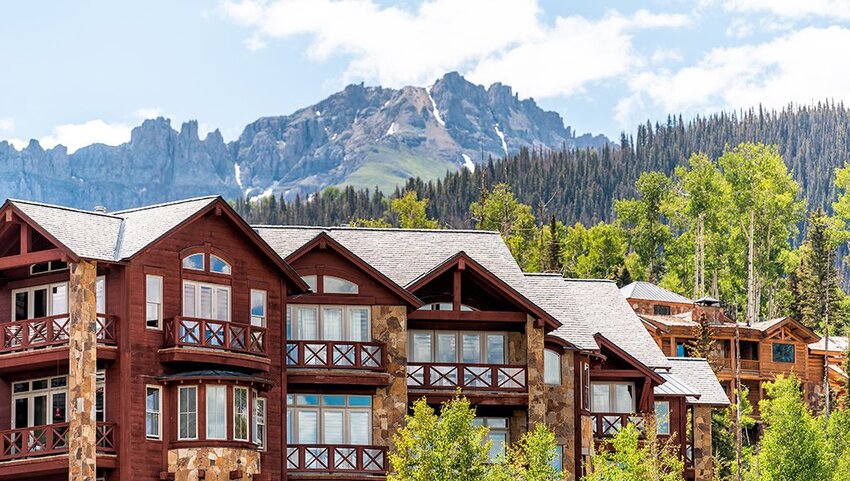 San Juan Mountains and modern resort lodge.