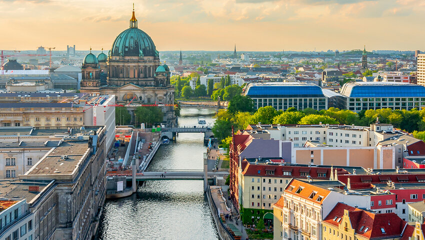 Berlin Cathedral on Museum island and Spree river at sunset.