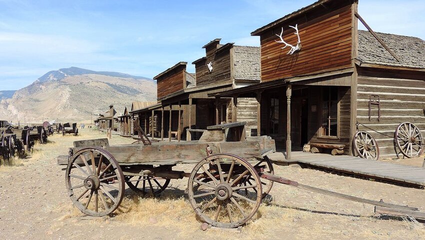 Wagon and old buildings in Old West Town village in Cody Wyoming.