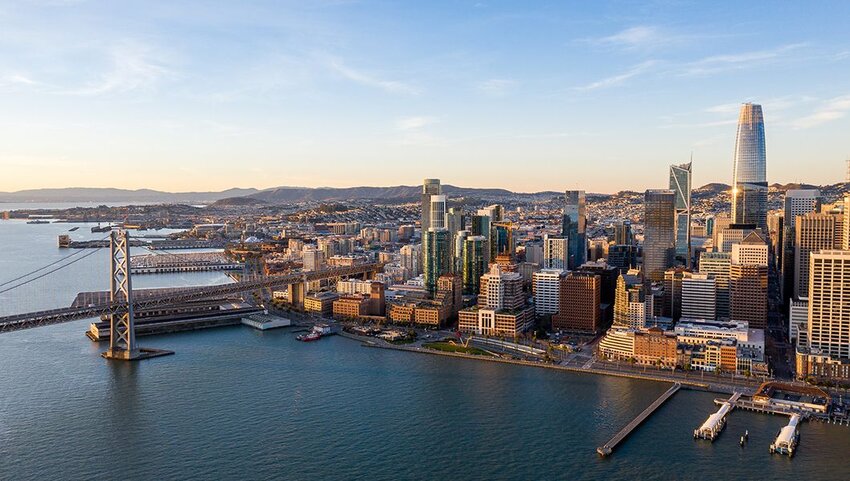 Aerial view of San Francisco at sunrise from over the San Francisco Bay.