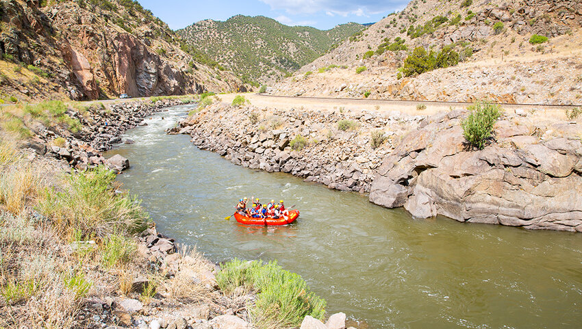 Raft of people going down Arkansas River.