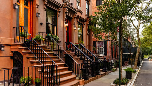 Brownstone facades & row houses at sunset in Brooklyn.