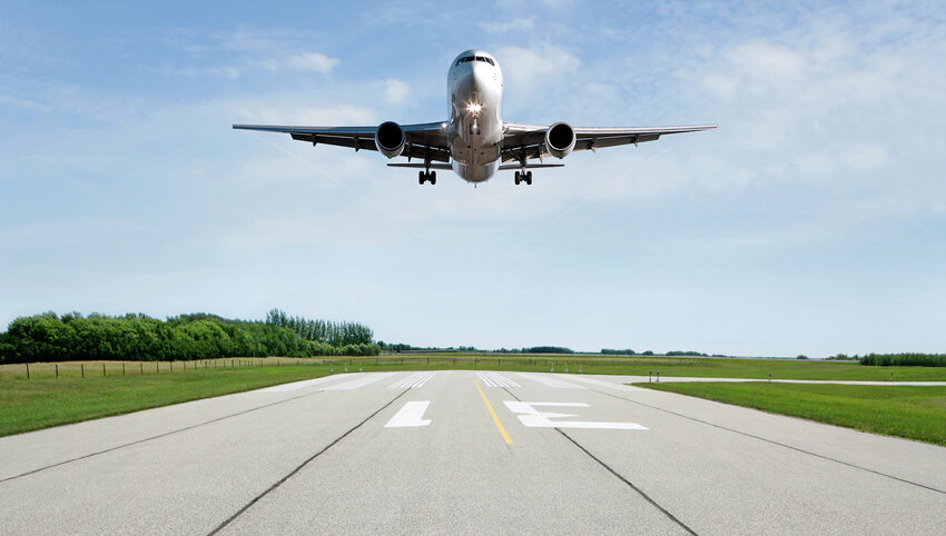 Plane landing on runway.