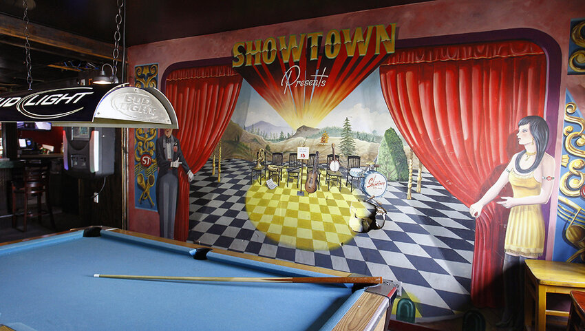 Interior of the Showtown Restaurant and Lounge, showing a pool table and mural.