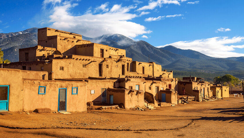 Taos Pueblo with mountains in the background