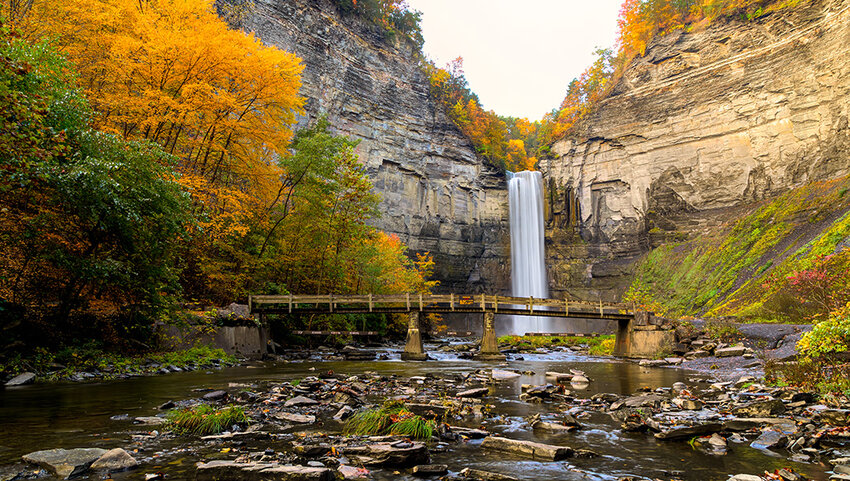 Taughannock Falls Gorge with Footbridge Creek at Sunrise In Full Fall Colors.