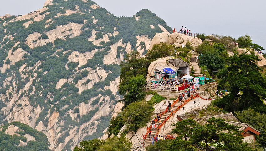 Aerial of structure and people on path on top of Mount Hua.
