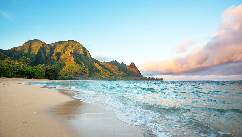 Beach on Kauai with mountains in distance