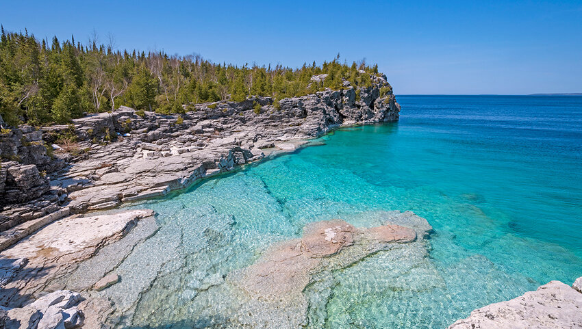 Clear Waters in a Gray Cliffed Cove at Indian Cove in Bruce Peninsula National Park.