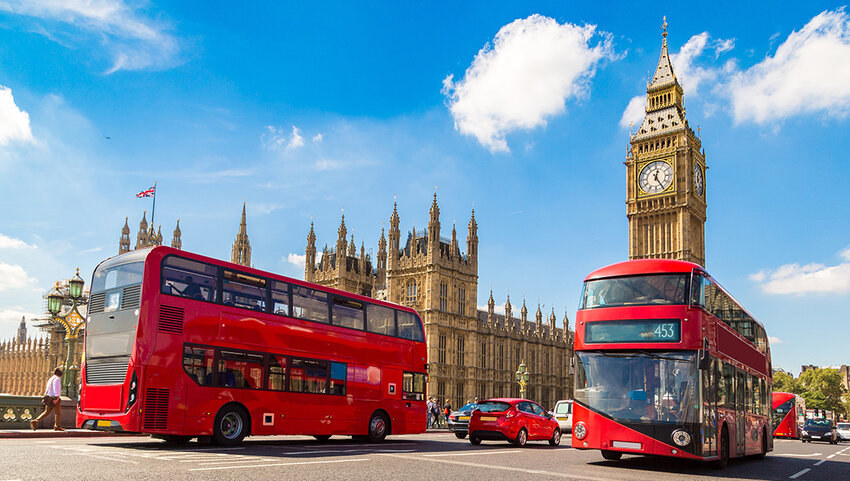 Big Ben, Westminster Bridge and red double decker buses.