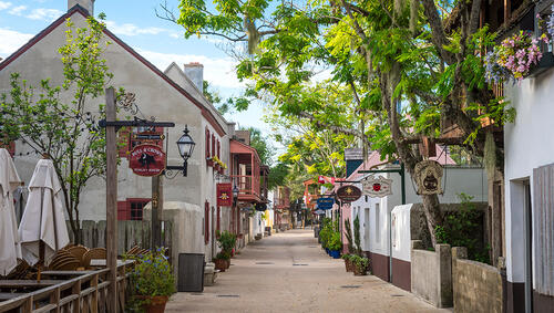 A pedestrianized street lined with shops and attractions in the Historic District of St Augustine.