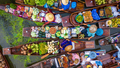 Overhead look view of boats filled with goods at floating market. 