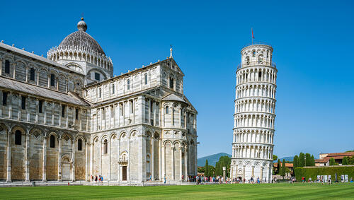 The leaning tower of Pisa with the cathedral in front.