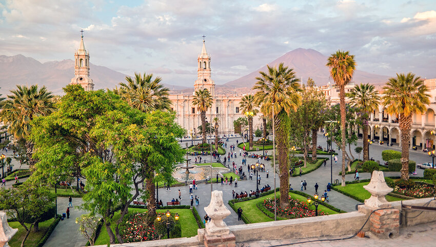 The main square of Arequipa, Peru with mountains in the background. 