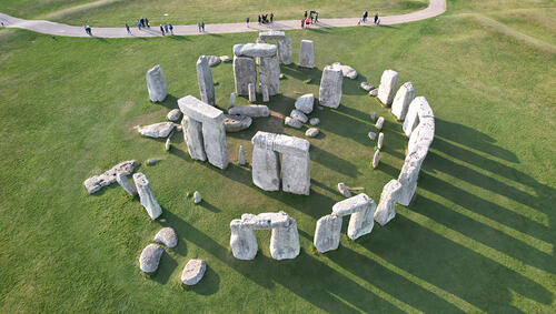 Aerial of Stonehenge and path with people. 