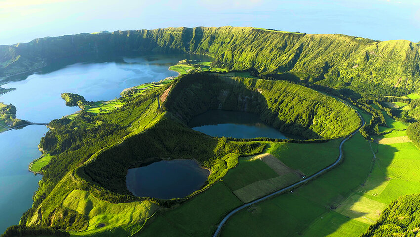 Aerial oflLakes in the craters of extinct, volcanoes surrounded by, green vegetation