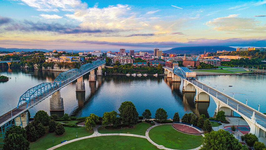 Aerial of Chattanooga skyline, river, and bridges.