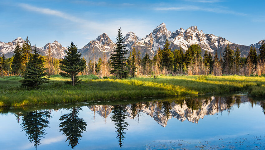 Mountain range with reflection in lake.