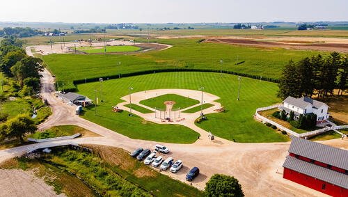 Aerial of baseball field next to cornfield. 