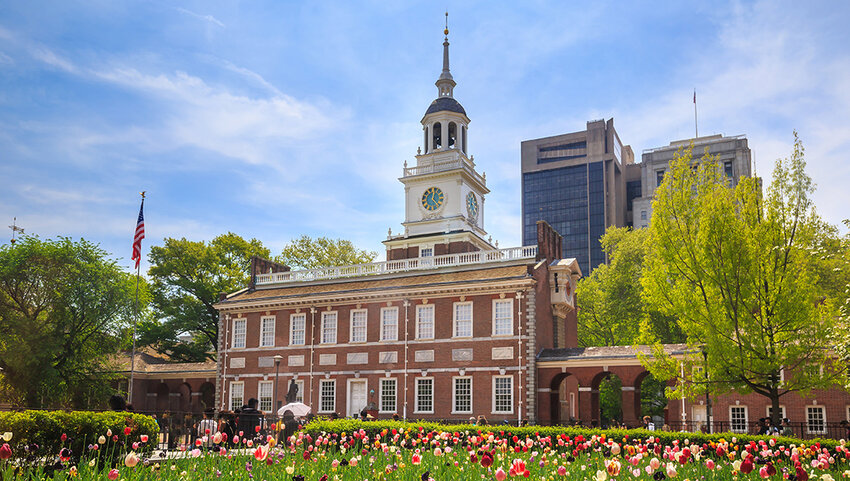 Independence Hall in the springtime, with tulips in front.