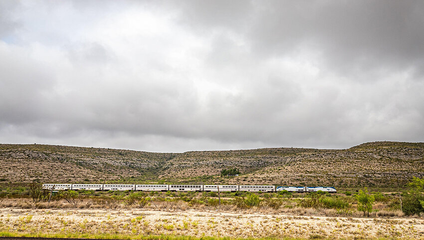 he Amtrak Sunset Limited train traveling through desert. 